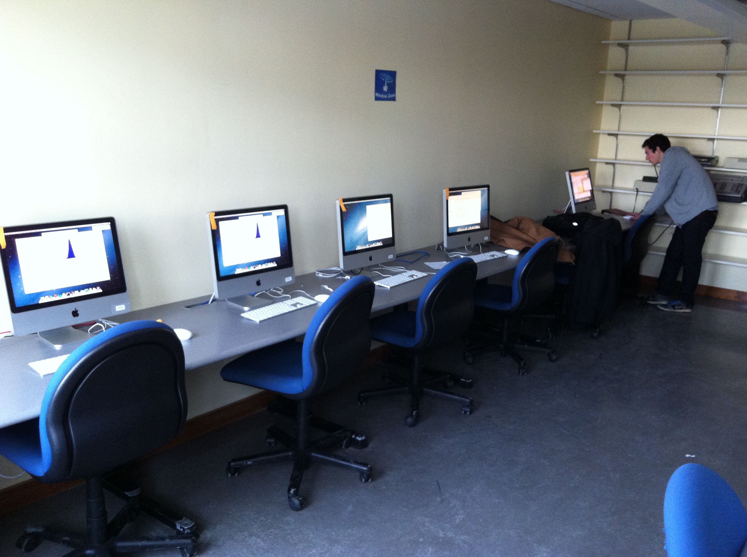 I suppose this was our idea for how to do _parallel computing_ at that stage in our lives. (Not pictured: another half-dozen computers working to the right.)
